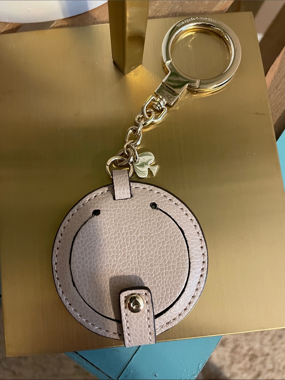 Kate Spade Gold Keyring with Taupe Leather Round Charm And Mirror